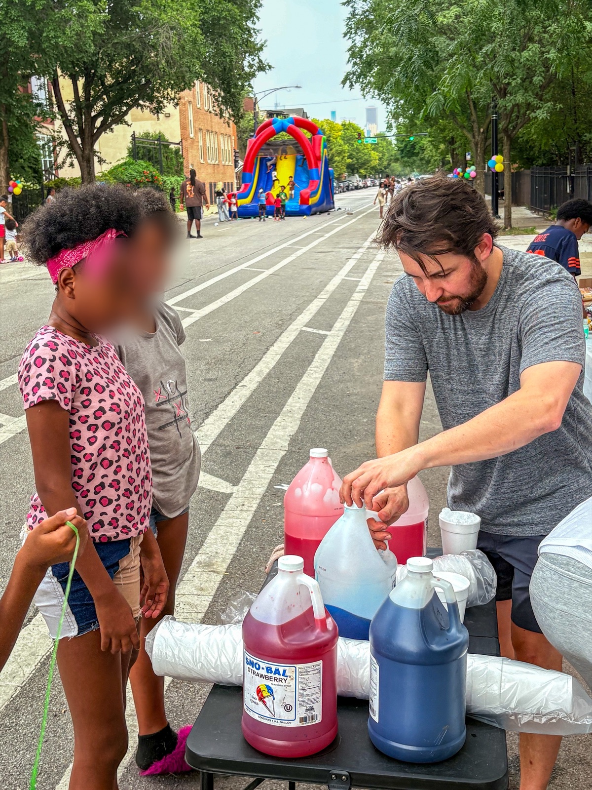 Nate serving snow cones at the annual back-to-school block party